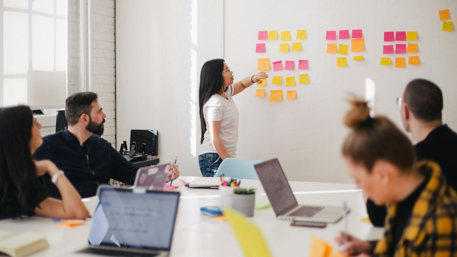 A focused planning session in a bright agency office