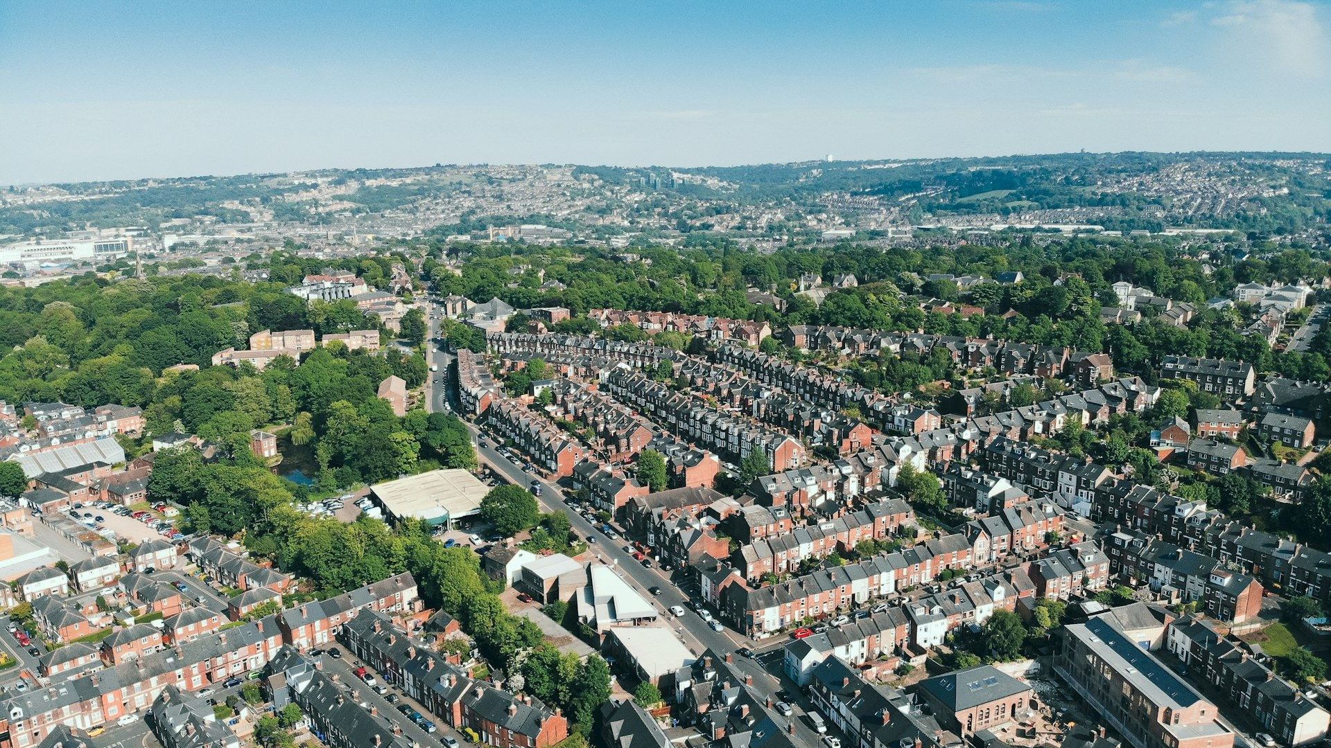 Aerial view over Sheffield's rooftops and surrounding hills